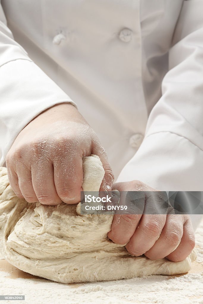 Kneading Dough Closeup of a chef kneading dough. Baker - Occupation Stock Photo