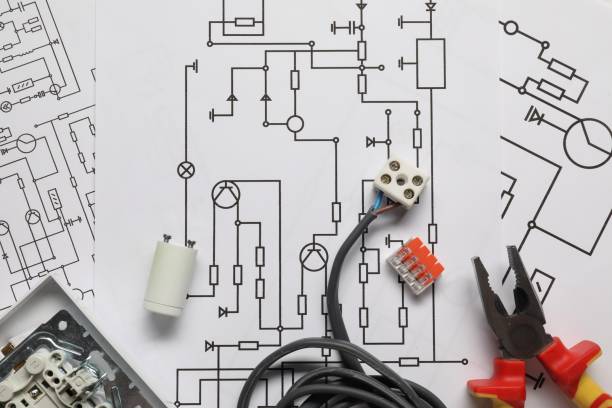 istock Wires, pliers and disassembled light switch on wiring diagrams, flat lay 1838430565