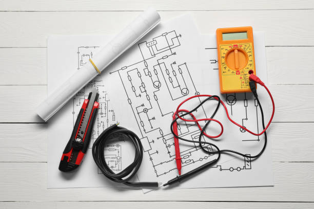 istock Wiring diagrams, wires and digital multimeter on white wooden table, flat lay 1838431649
