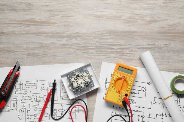 istock Wiring diagrams and digital multimeter on white wooden table, flat lay. Space for text 1838432176