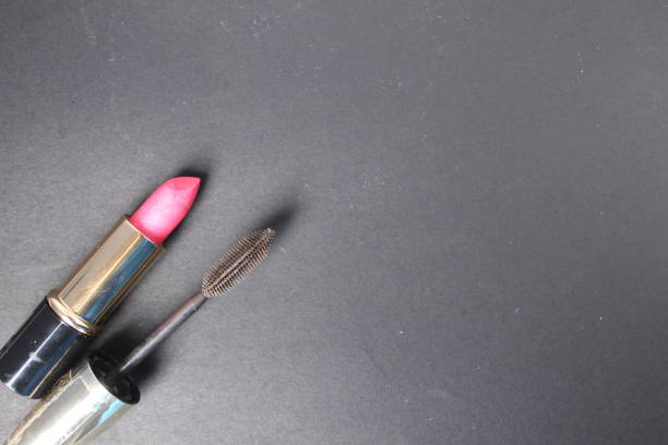 istock Red pink lipstick and mascara on a black background with space for the text moka copyspace. How to Wear Makeup for Every Day 1838433724
