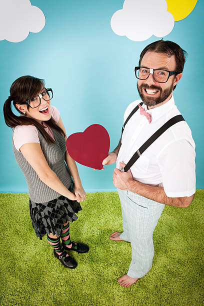 istock Happy, Nerdy Man Giving Young Woman Tin Heart 183843849