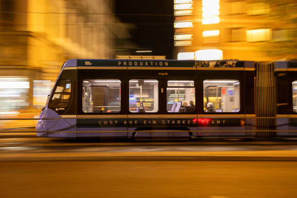 istock a tram in motion driving on the tracks at night time 1838439496
