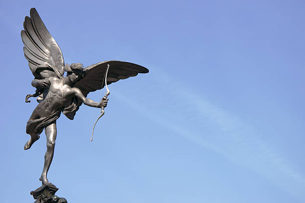 The Shaftesbury Memorial Fountain is located at the southwestern side of Piccadilly Circus in London, United Kingdom. Moved after World War II from its original position in the centre, it was erected in 1892–1893 to commemorate the philanthropic works of Lord Shaftesbury, who was a famous Victorian politician and philanthropist. The monument is topped by Alfred Gilbert's winged nude statue generally known as Eros. The statue has become a London icon: a graphical illustration of it is used as the symbol of the Evening Standard newspaper and appears on its masthead. It was the first in the world to be cast in aluminum and is set on a bronze fountain, which itself inspired the marine motifs that Gilbert carved on the statue.
