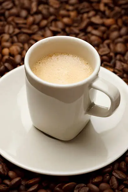 A Cup of espresso on coffeebeans