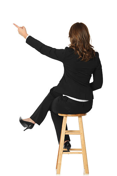 istock Businesswoman sitting on a stool 183844974