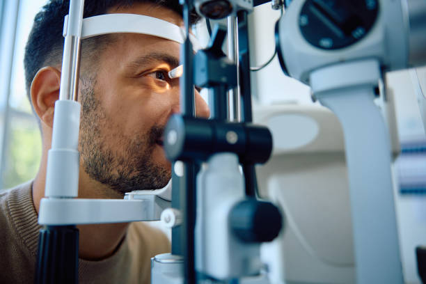istock Young man during eyesight exam at ophthalmic clinic. 1838450881