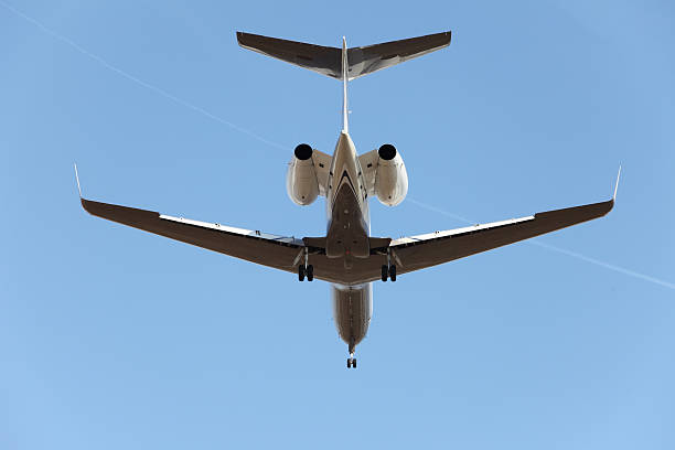 Corporate jet from below stock photo