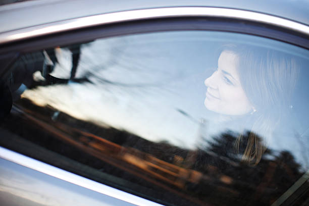 istock Young woman driving her car. 183845477