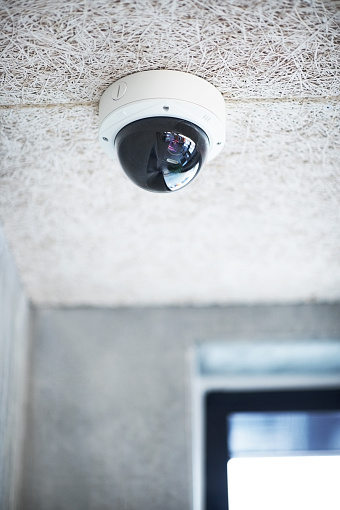 Dome type overhead surveillance camera on the ceiling