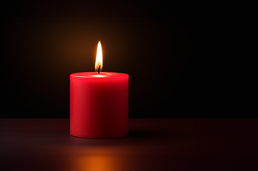 Red candle in the dark