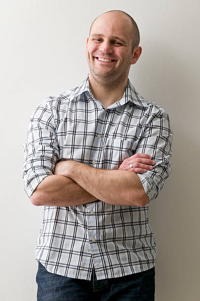istock smiling man with arms crossed 183846045