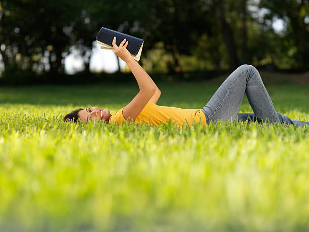 istock Joyful woman studying the Bible 183846442