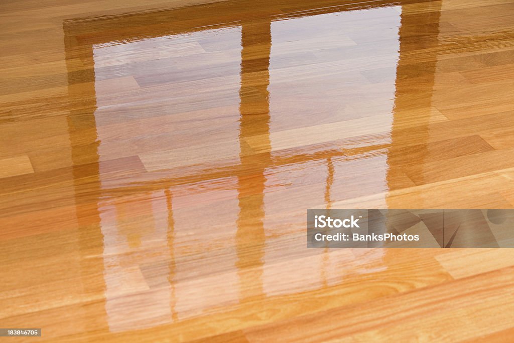 Wet Polyurethane on New Hardwood Floor with Window Reflection  Hardwood Floor Stock Photo