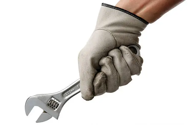 Photo of Isolated shot of holding a wrench on white background
