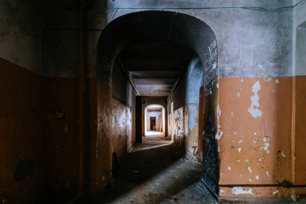 istock Dark creepy corridor of abandoned building 1838470227