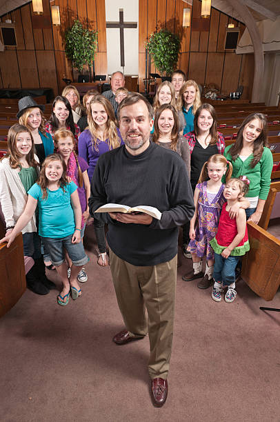 istock Casual Pastor with His People Behind 183847209