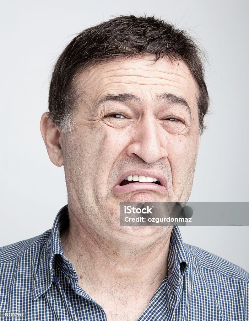 Man making a face "Man making a face,close up" Grimacing Stock Photo