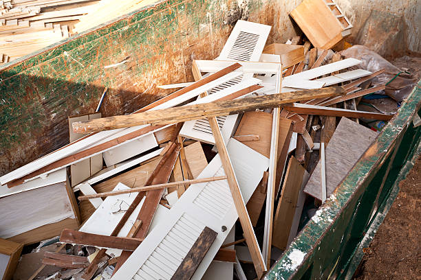 Home renovation debris inside a dumpster.