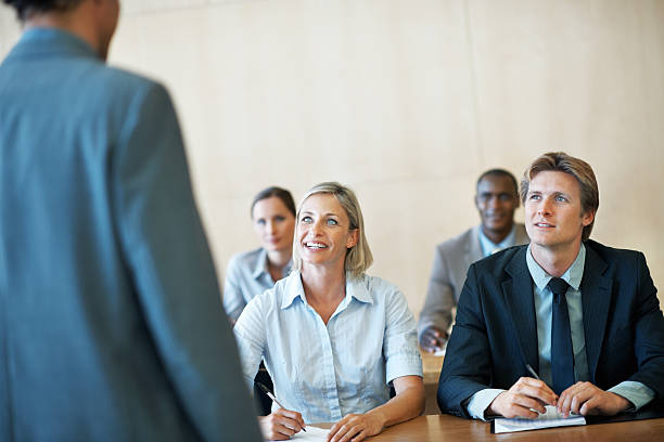 istock Business people smiling during a presentation 183848692