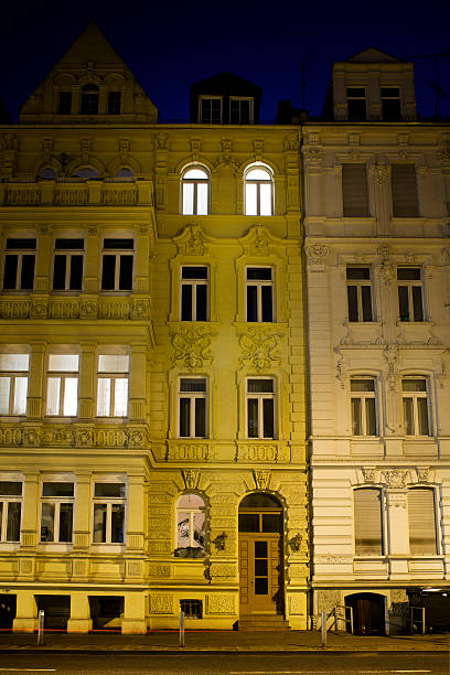 istock Illuminated old buildings facade (Wilhelminian Style) at night 183848693