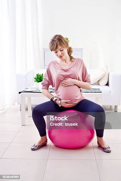 Pregnant Woman Doing Exercises Stock Photo - Download Image Now - 20-24 Years, Abdomen, Adult