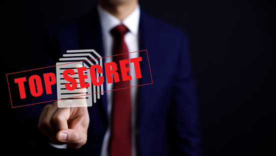 Businessman hand touch top secret folder, Top Secret organized business, legal and government, Online documentation database and document management system, criminal folder with confidential documents