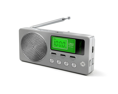 Digital radio receiver with elongated antenna gray concrete background