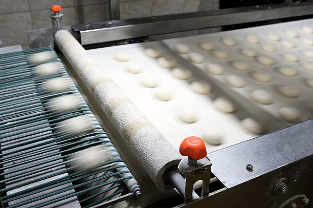 Slightly blurred image of production line for burger breads