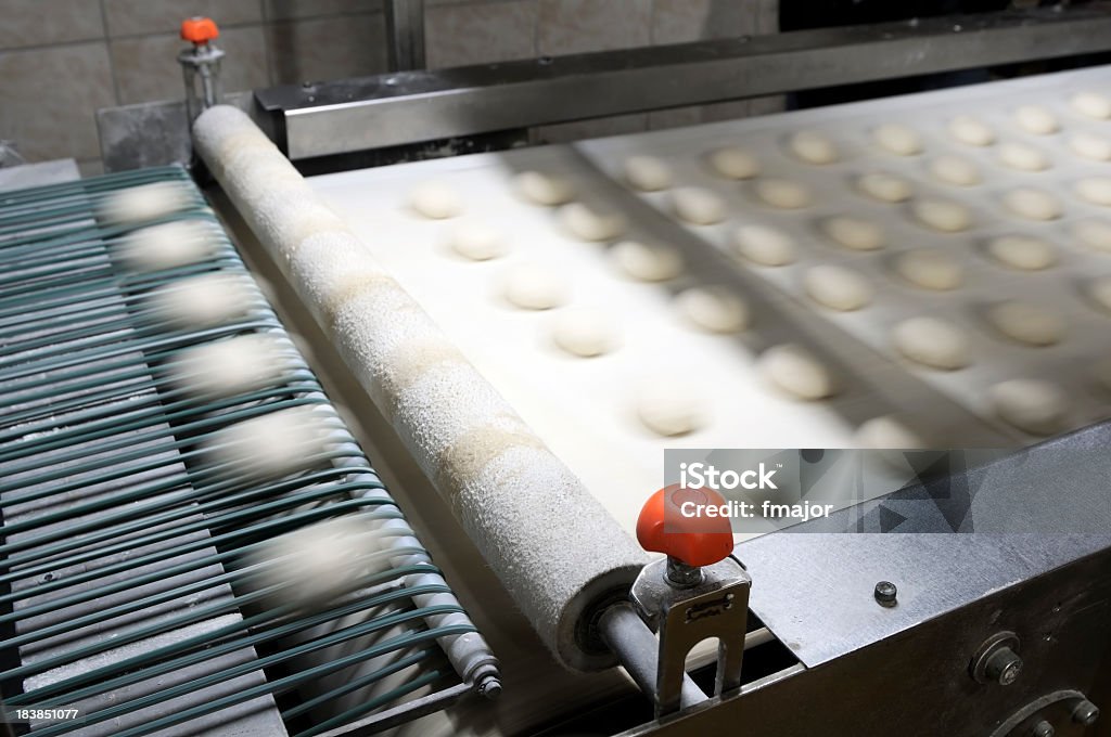 Slightly blurred image of production line for burger breads Production line and Semi-finished products in the bakehouse Food Processing Plant Stock Photo