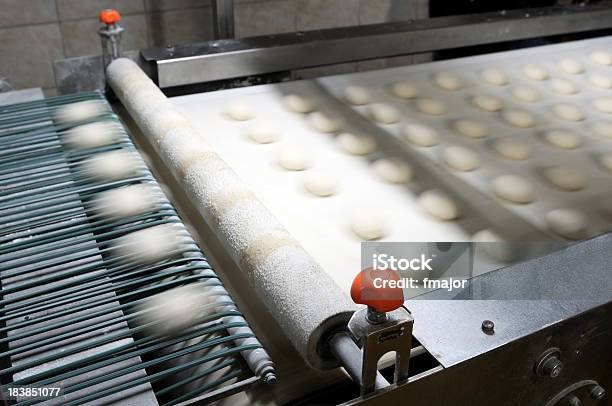 Slightly Blurred Image Of Production Line For Burger Breads Stock Photo - Download Image Now