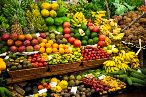Colourful fruit and vegetable market stall in a rustic display