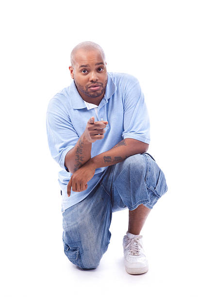 istock Adult Man Kneeling and Pointing Forward, on White Background 183851925