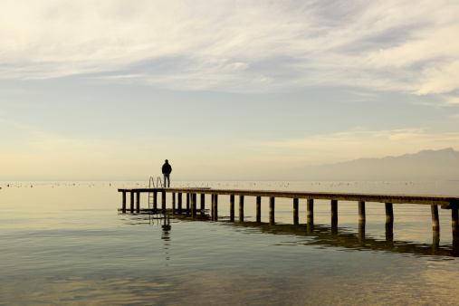 Man standing on jetty