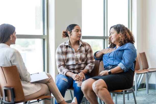 istock Mother gestures while speaking to her daughter in counseling 1838520693