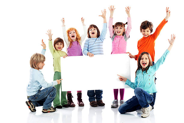 istock Large group of kids holding a big blank paper. 183852396