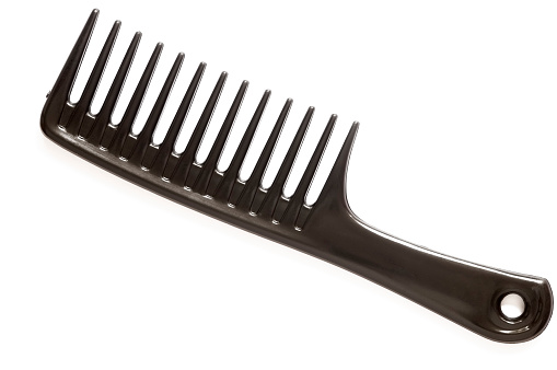 Royalty free stock photo of black comb isolated on white background