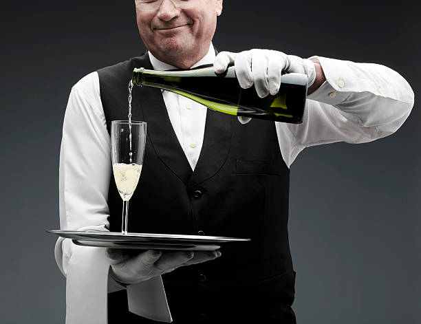 バトラー注ぐシャンパン - butler champagne service waiter ストックフォトと画像