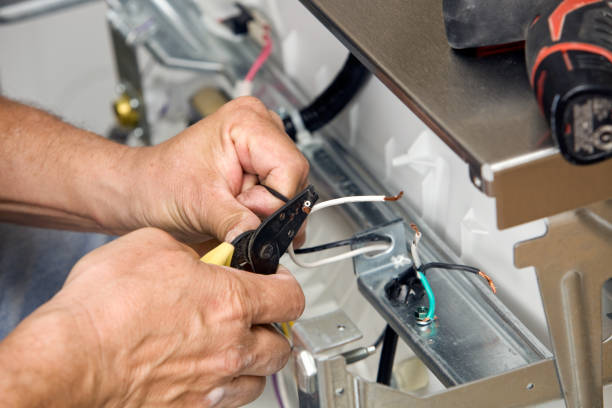 Electrician Strips Wires for a Dishwasher Installation  wire cutter stock pictures, royalty-free photos & images