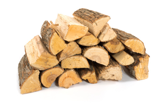 A stack of split firewood on a white background