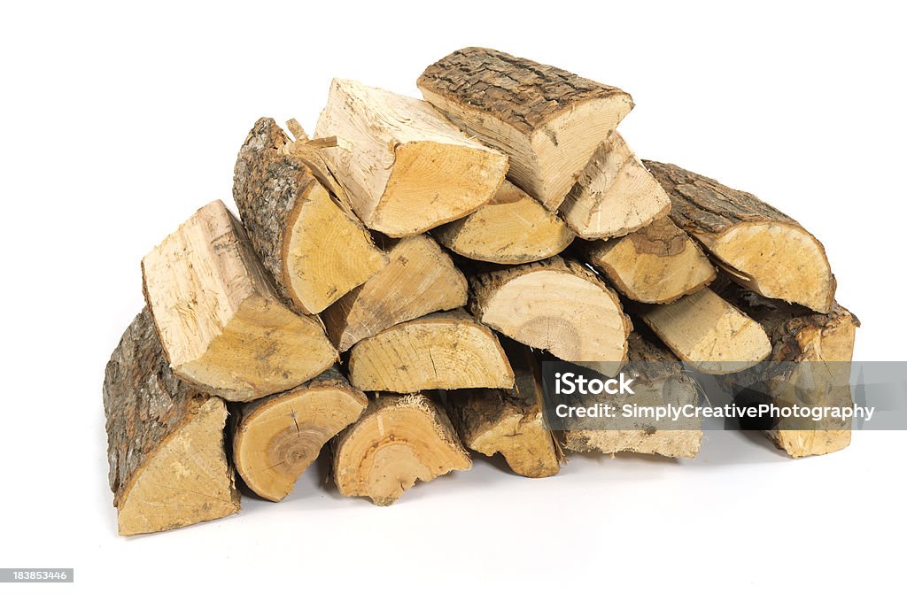 A stack of split firewood on a white background Firewood, split, stacked, and isolated on white. Firewood Stock Photo