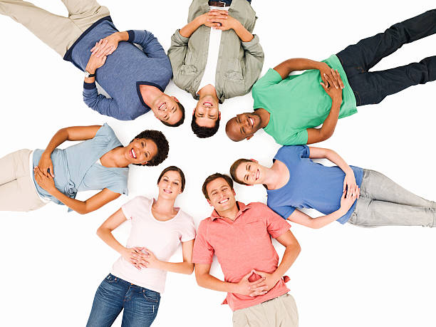 istock Young Adults Lying in a Circle 183854137
