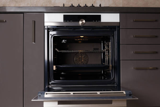 istock Built-in electric oven with open door in the kitchen. 1838542546