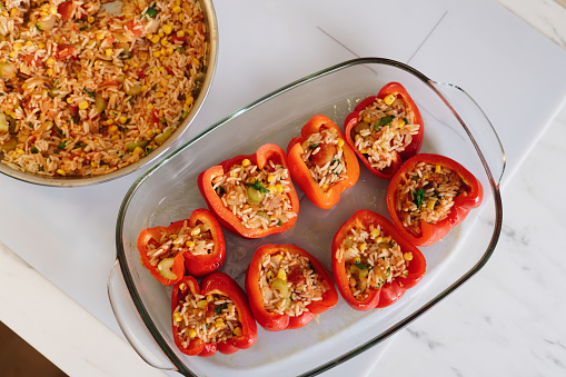 Cooking vegetarian stuffed peppers for dinner