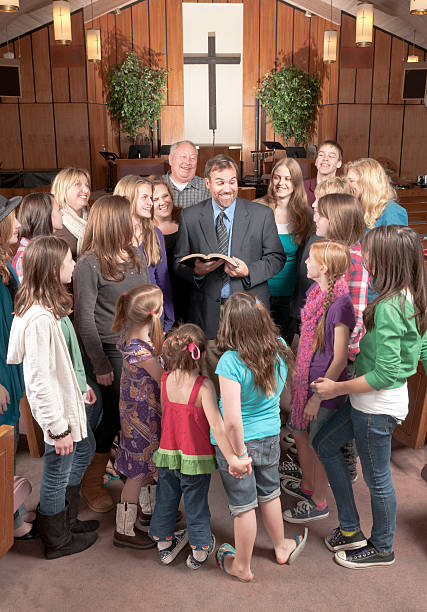 istock Pastor with His People Around Him 183854563