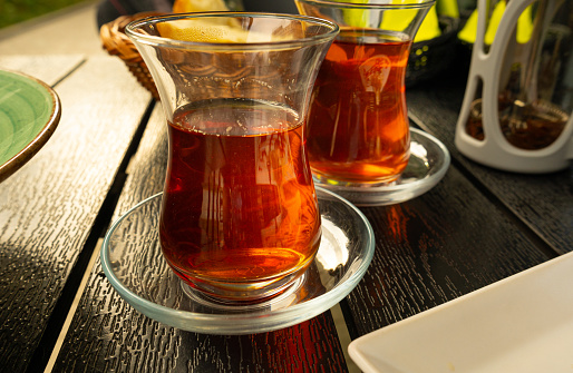 Turkish Tea on a Street Cafe Table, Traditional Arabic Cup in Restaurant, Black Tea Drinking in Turkish Cup, Arabic Breakfast