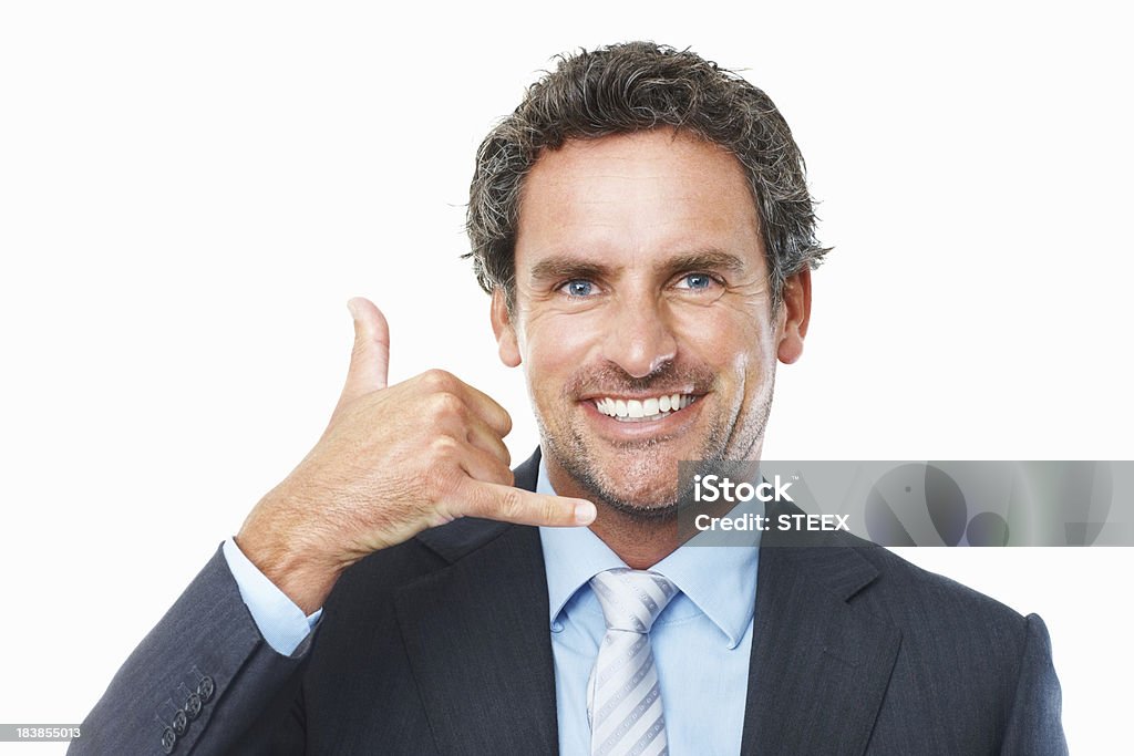 Call me Closeup of smiling middle aged business man showing call me sign Call Me Gesture Stock Photo