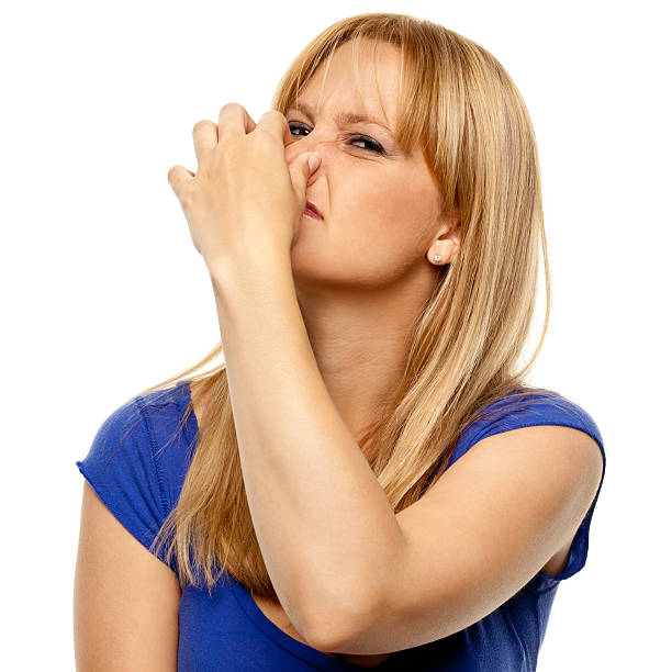 istock Disgusted Woman Pinches Nose 183855216