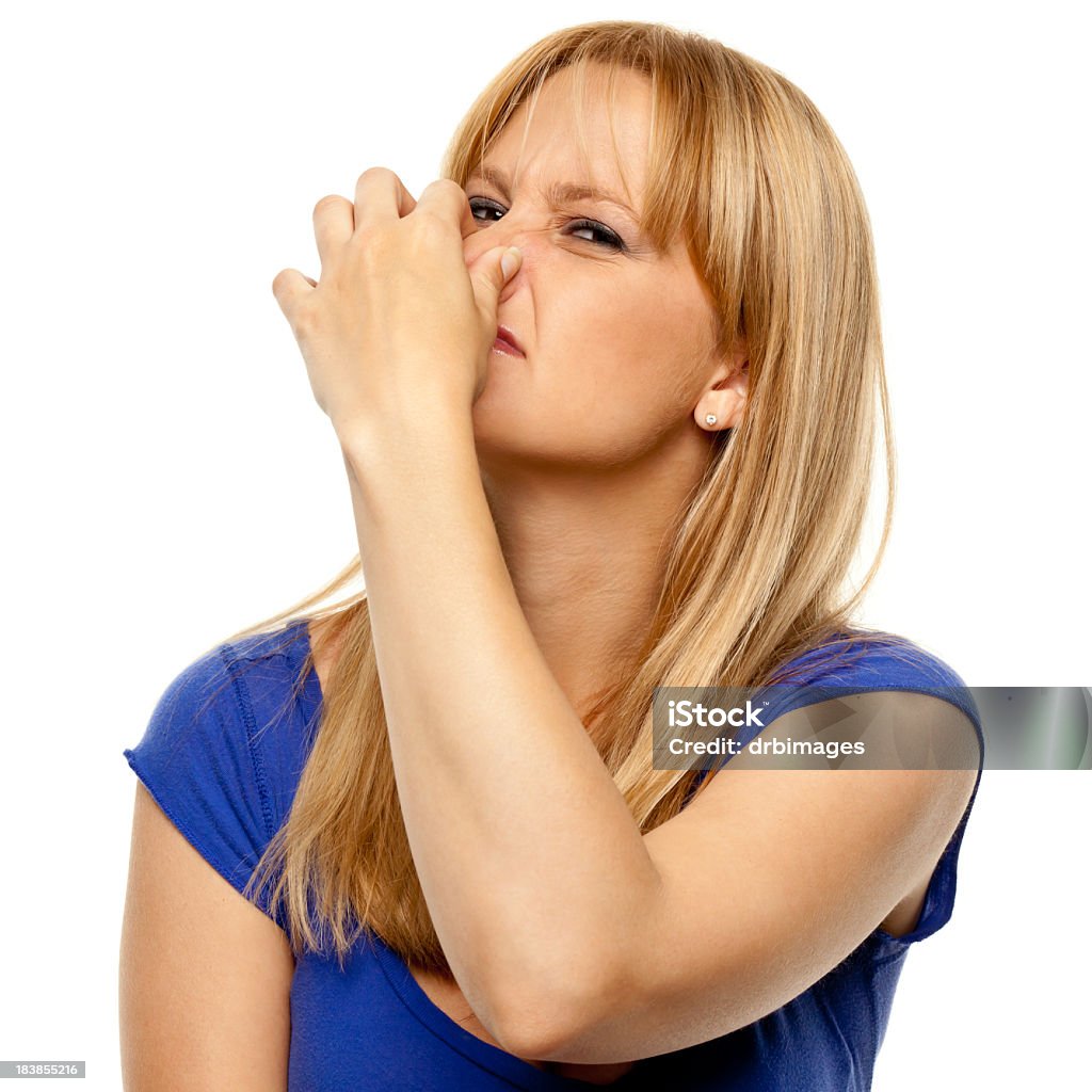 Disgusted Woman Pinches Nose Portrait of a woman on a white background. http://s3.amazonaws.com/drbimages/m/jencul.jpg Fart Stock Photo