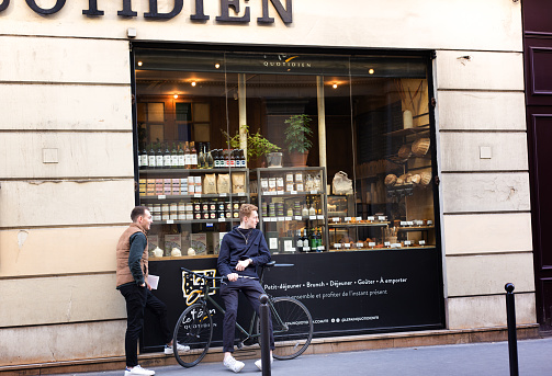 Paris, France: Two men relax outside Le Pain Quotidien, a restaurant in the 2nd arrondissement.